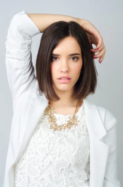 Beautiful elegant girl posing in studio isolated on gray backgro — Stock Photo, Image