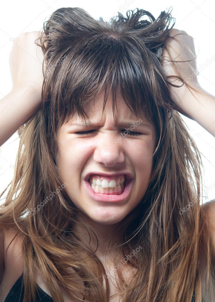 Angry teenage girl screaming isolated on white background