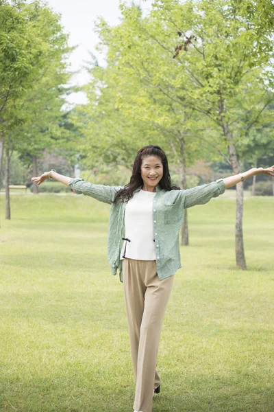 Older women smile at the camera — Stock Photo, Image