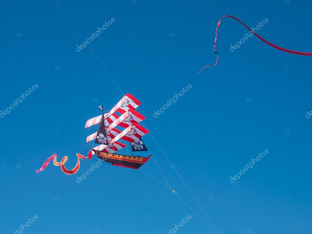 Colorful Pirate Ship Kite Flying in Cloudless Blue Sky — Stock Photo © Frankljunior 57328021
