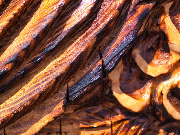 Textura de madera tallada y quemada de la escultura de motosierra —  Fotos de Stock