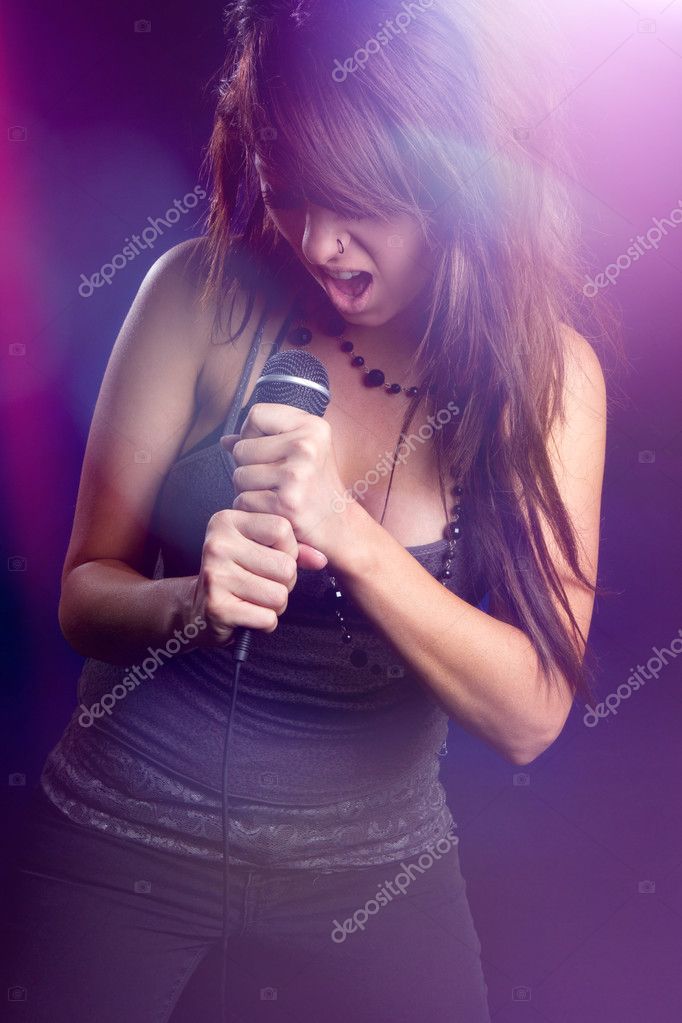 Female Singer in Lights Stock Photo by ©keeweeboy 123856738