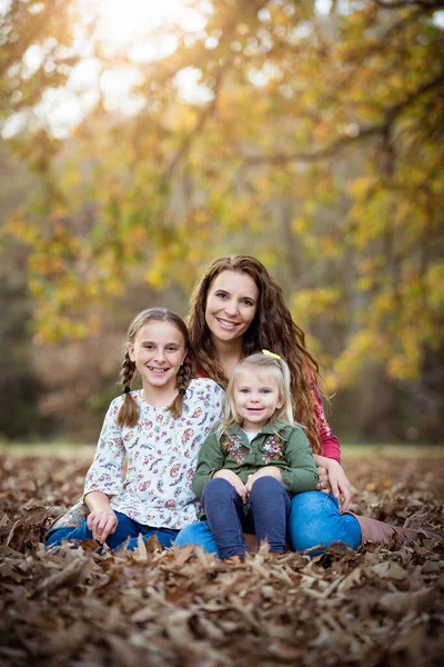 Mom Two Daughters Sitting Leaves Stock Picture