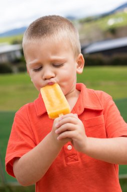 Boy Eating Popsicle clipart