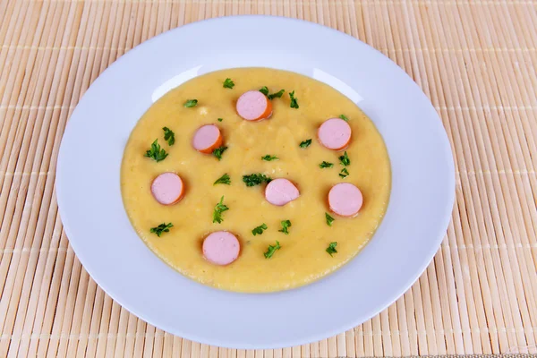 Yellow soup with sausage — Stock Photo, Image