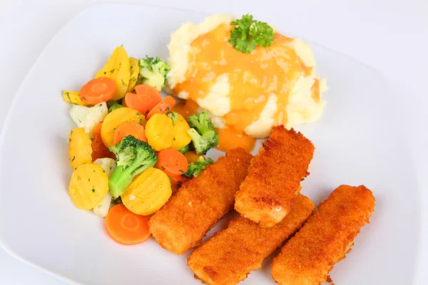 Fish fingers with mashed potatoes and vegetable — Stock Photo, Image