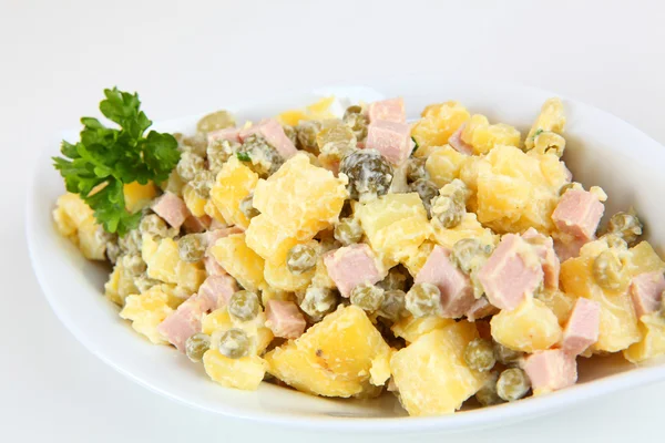 Potato salad with peas and sausage — Stock Photo, Image