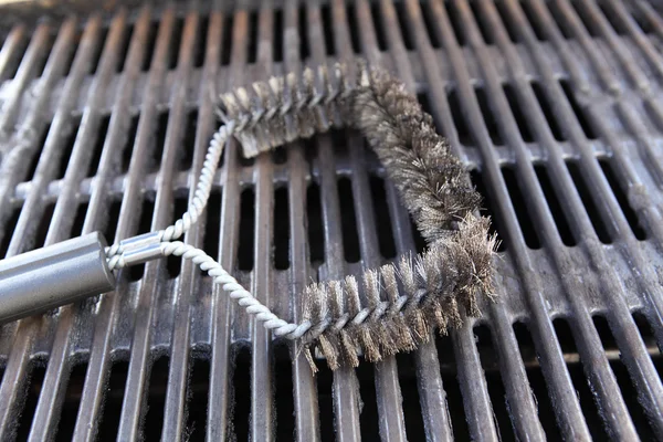 steel brush to clean a barbecue