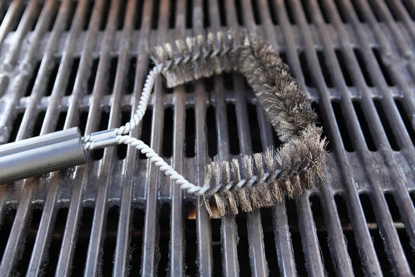 steel brush to clean a barbecue