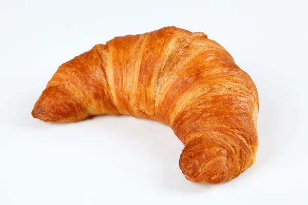 Croissant met witte achtergrond — Stockfoto