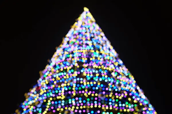 Beautiful christmas tree defocused with lights glowing — Stock Photo, Image