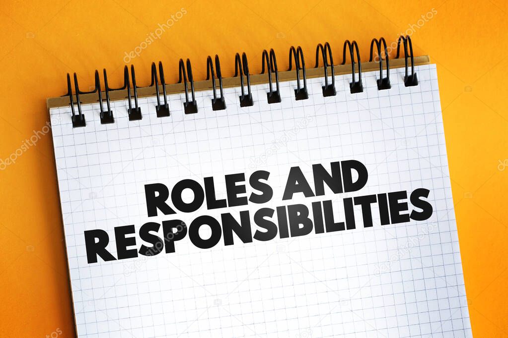 Roles And Responsibilities text quote on notepad, concept backgroun