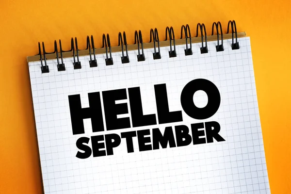 Hello September text quote on notepad, concept backgroun