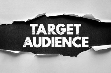 TARGET AUDIENCE message under torn paper concept representing marketing focus, customer segmentation, and communication strategy for branding and advertising visuals