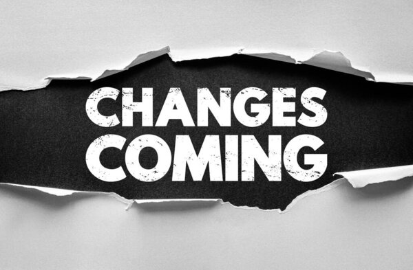 CHANGES COMING text under ripped paper background. Motivational message concept for transformation, progress, and opportunity themes in business, life, or leadership contexts