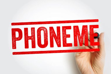 Kalın kırmızı damga ile yazılmış bir el işareti ile PHONEME konuşma seslerini, dilsel birimleri, dil öğrenme, okuma talimatları ve fonolojik farkındalık kavramlarını sembolize eder.