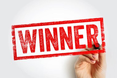 Kazanan damgası bir el ile işaretlenmiş, başarıyı, başarıyı ve tanınmayı sembolize ediyor. Kompozisyon, yarışmalarda ve değerlendirmelerde başarıyı ve olumlu sonuçları çağrıştırıyor