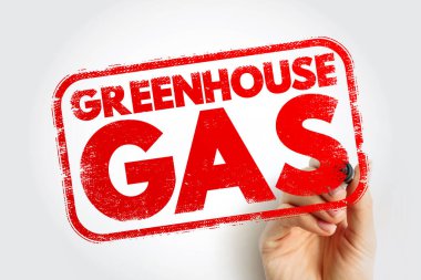 Çevresel sorunları, iklim tartışmalarını, emisyon farkındalığını, sürdürülebilirlik konularını ve küresel etki kavramlarını gösteren, bir insan eli tarafından tutulan damgalı bir işaret olarak gösterilen sera gazı metni