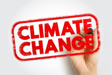 Kauçuk damga kutusundaki metni, elinde kalem olan bir el yazısıyla ikile. Küresel ısınma, çevre sorunları, sürdürülebilirlik ve ekolojik etki farkındalığı kavramı