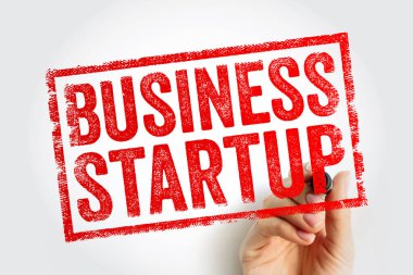 Kauçuk damga içinde elle yazılmış İŞ STARTUP metni. Piyasada yeni ticari projeler başlatma, girişimcilik stratejisi, kurumsal planlama ve finansal büyüme kavramı