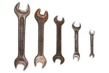 Different size old wrenches isolated on white