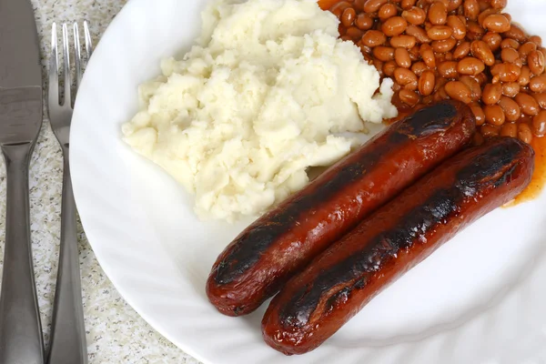 Top view sausages beans mashed potatoes — Stock Photo, Image