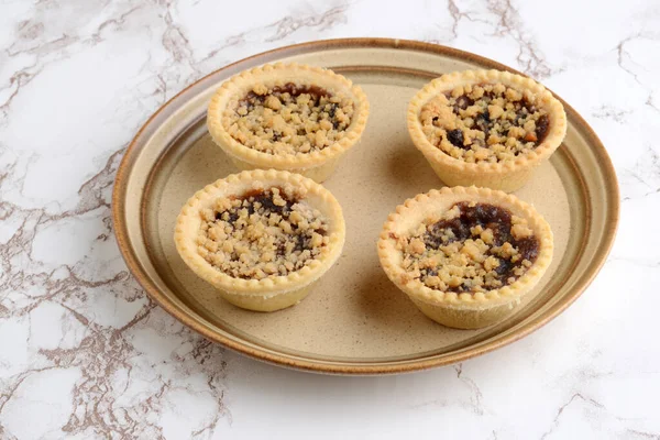 Four Fruit Crumble Tarts Brown Plate — Stock Photo, Image