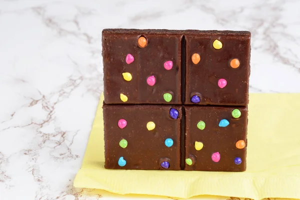 chocolate fudge brownie bar with candy pieces