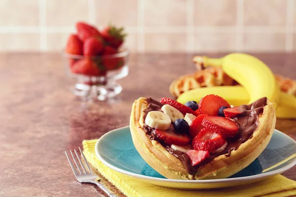 closeup breakfast waffle fruit sandwich with chocolate spread