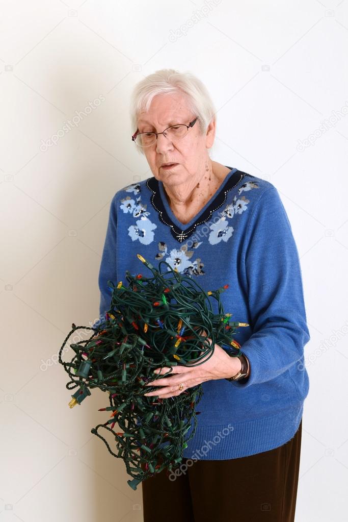 Senior confused with tangled christmas lights