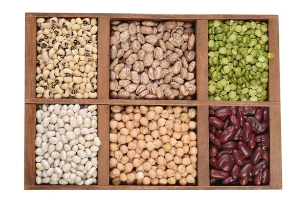 Wood box of dried beans and peas — Stock Photo, Image