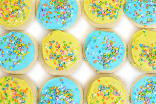 Blauwe en gele Pasen cookie achtergrond — Stockfoto