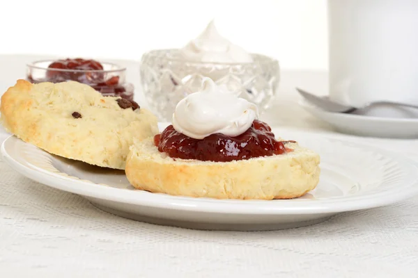 Scone with jam and cream — Stock Photo, Image