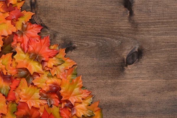 Pile maple leaves in corner — Stock Photo, Image