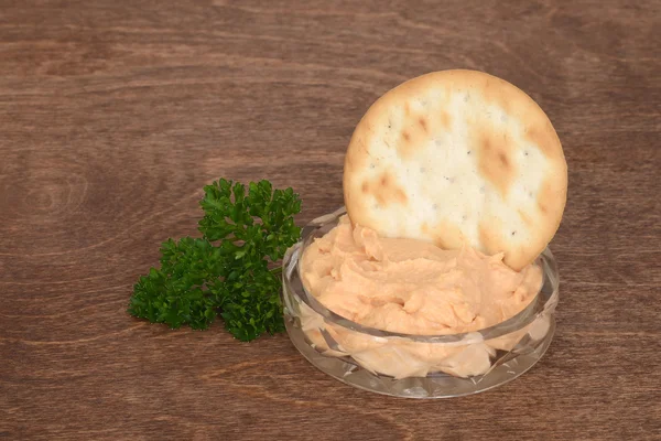 Dish of salmon pate with parsley on wood — Stock Photo, Image