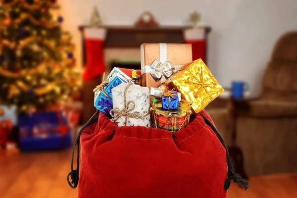Santa claus pytel plný dárků — Stock fotografie