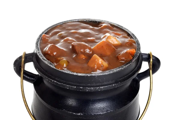 Isolated macro beef stew in cauldron — Stock Photo, Image