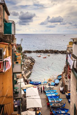 Riomaggiore, Italy, September 22, 2015: A street leading to the Mediterranean coast in the village on Riomaggiore in Italy