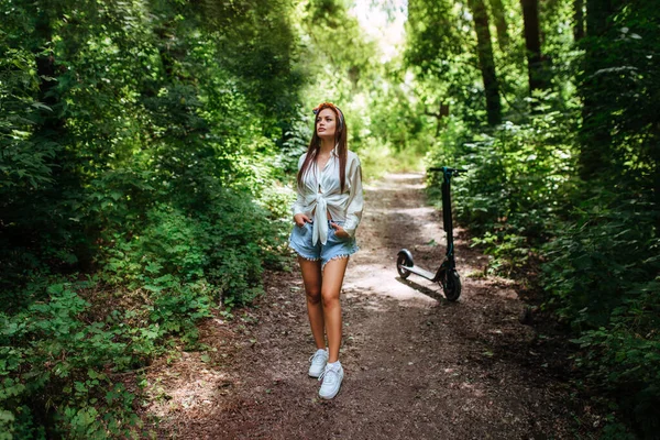 Cute Brunette Girl Rides Electrode Scooter Park She Wearing White — Stock Photo, Image