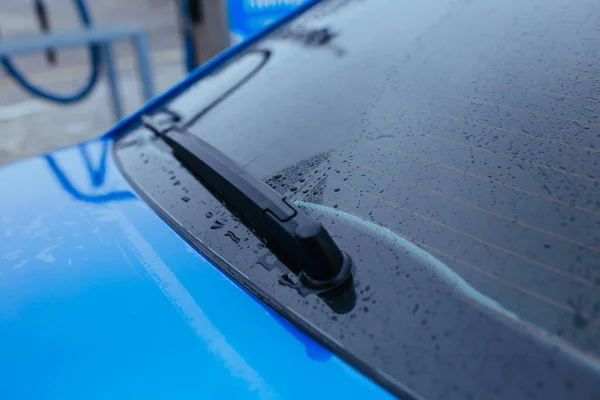 water drops on the rear window of the car. car wash concept