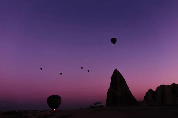 silhouette of beautiful hot air balloons at sunrise in cappadocia