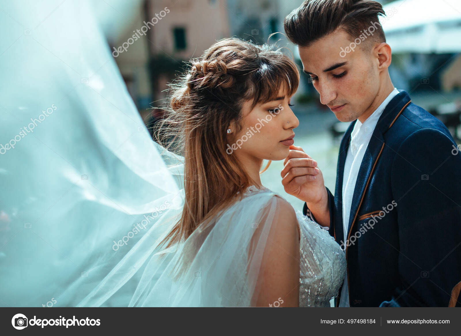 Wedding. The bride and groom kiss on the street closeup. beautiful