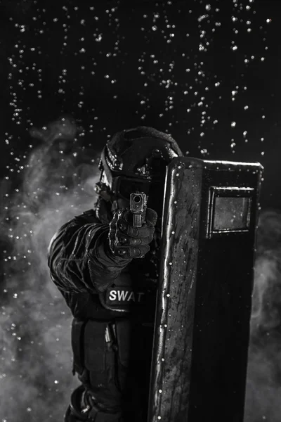 Police officer with ballistic shield — Stock Photo, Image