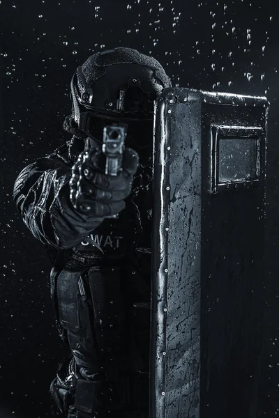 Police officer with ballistic shield — Stock Photo, Image