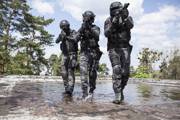 Spec ops police officers SWAT in the water