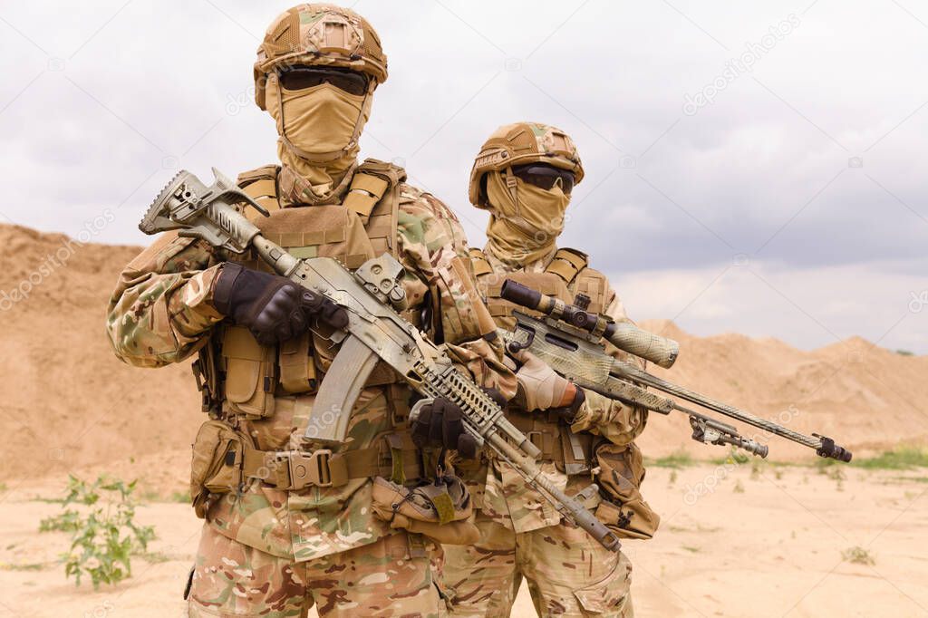 Two equipped and armed special forces soldiers
