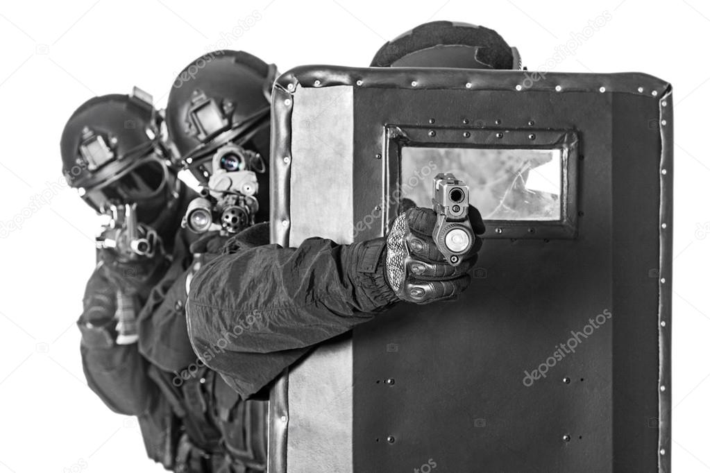 SWAT officers  with ballistic shield