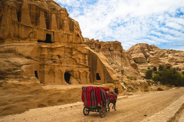 Horse cart and Obelisk Tomb, a Nabataean monument in petra, jordan