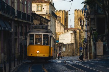 classic and touristy route, number 28 tram of lisbon in portugal clipart