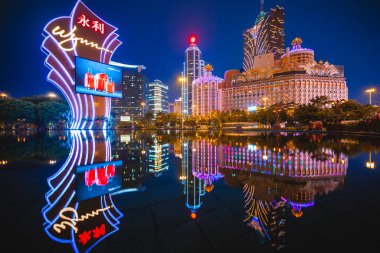 February 27, 2017: Casinos in Macau, China. Wynn Macau is a luxury hotel and casino resort operated by international resort developer Wynn Resorts. Casino Lisboa is owned by the STDM built in 1970. clipart